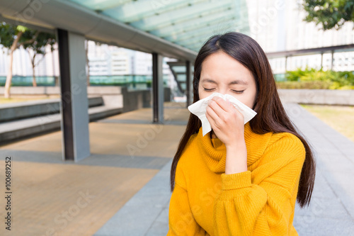 Asian woman runny nose