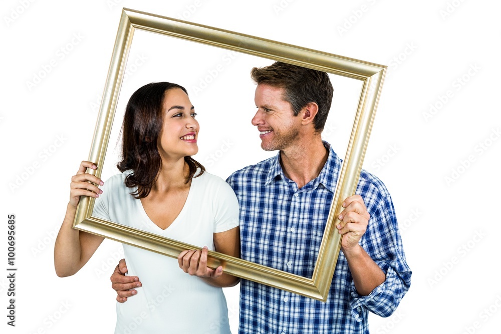 Couple holding picture frame Couple holding picture frame