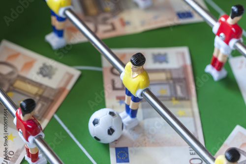 Sports and money. Concept about money spending in football (soccer), sports betting and manipulated fixed matches