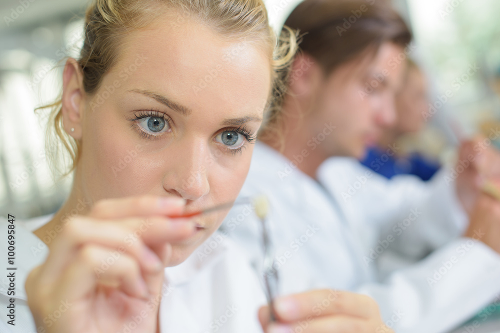 Close up of female dental technician working