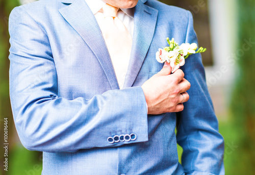 wedding boutonniere on suit of groom