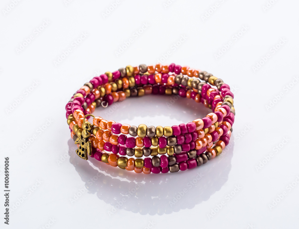 Beautiful bracelet with colorful beads isolated on white background Beautiful bracelet with colorful beads isolated on white background