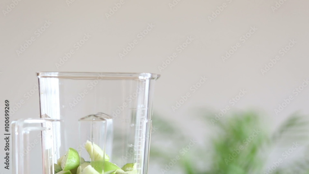 Hand putting food in blender Hand putting food in blender