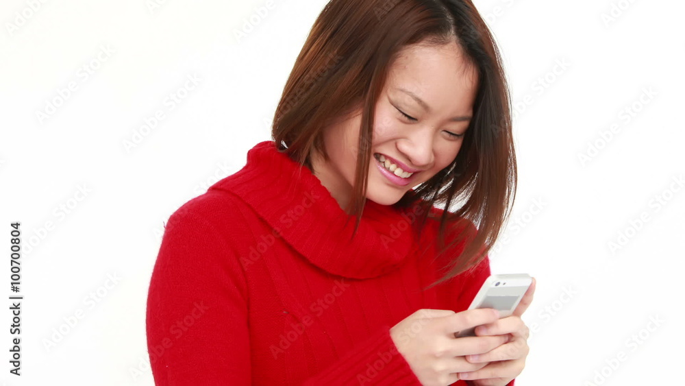 Smiling woman using smartphone Smiling woman using smartphone
