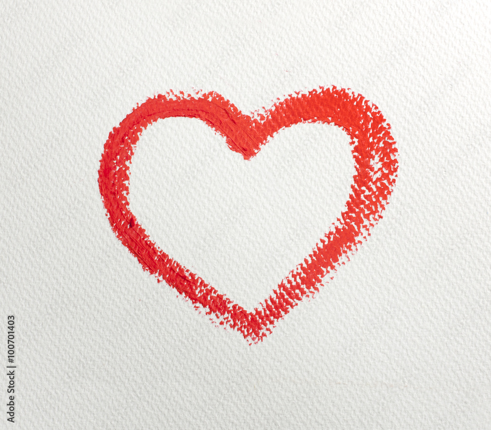 Close up of lipstick heart shape on white background.