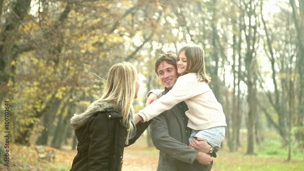 Young family having fun together in the park Young family having fun together in the park