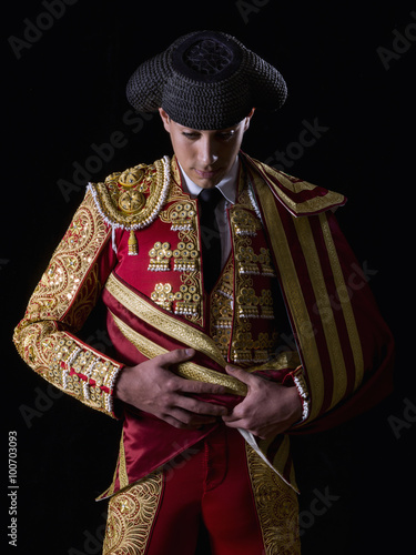 Young bullfighter, dressed in traditional costume to fight