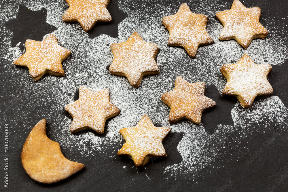 STARRY SKY MADE BY STARS AND MOON SHAPE COOKIES OVER SLATE STARRY SKY MADE BY STARS AND MOON SHAPE COOKIES OVER SLATE