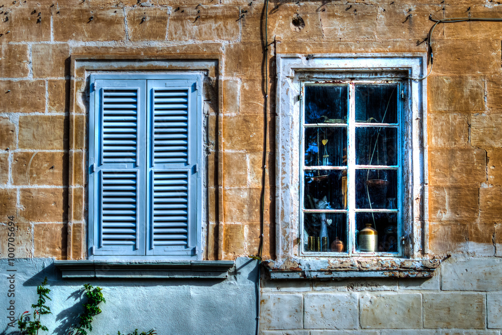 Two blue old windows HDR, one closed shutters