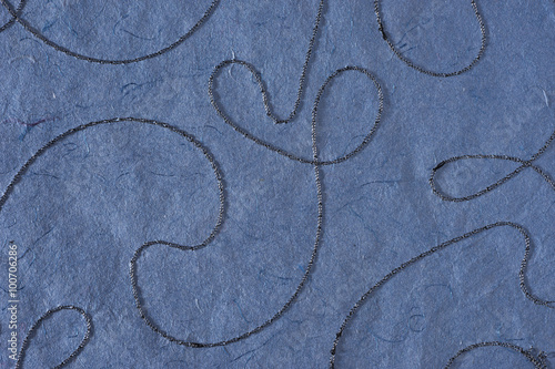 Blue paper texture background. Waves shapes stitched pattern. Like self made paper sheet photo