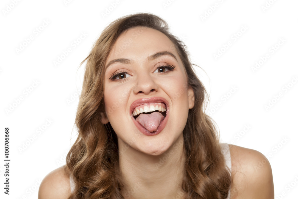 funny young woman with tongue sticking out funny young woman with tongue sticking out