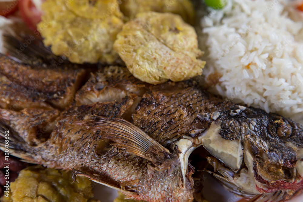 fried fish served with beans, rice and banana, typical from Nicaragua fried fish served with beans, rice and banana, typical from Nicaragua