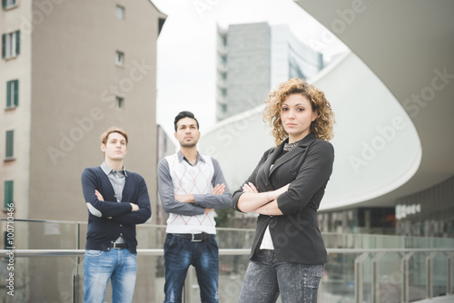 Foto Knee figure of multiracial business people working posing outdoo