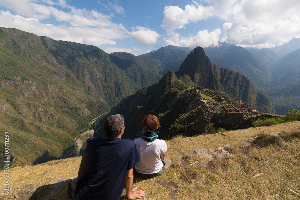 Couple looking at Machu Picchu, Peru, from above