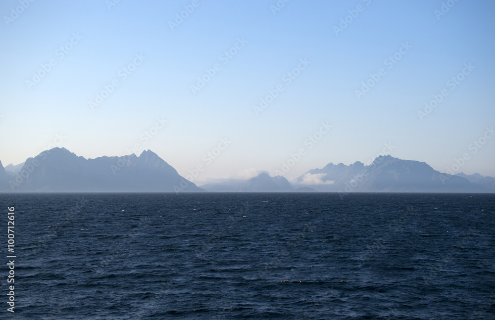 Silhouettes of Lofoten islands in the fog, Norway