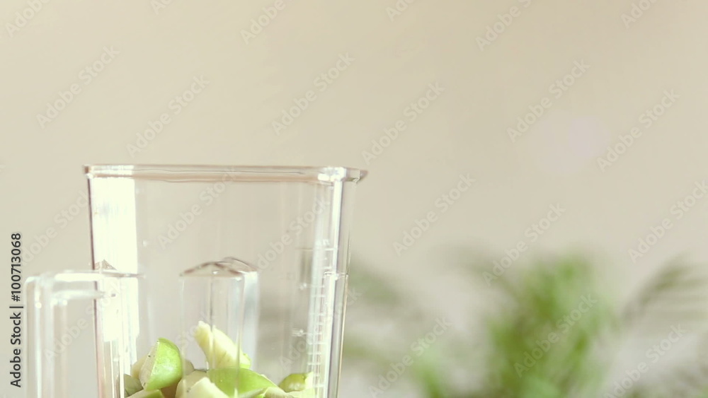 Hand putting food in blender Hand putting food in blender