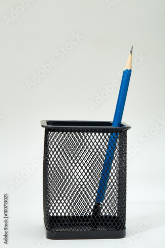 pencils in metal pot on a white background