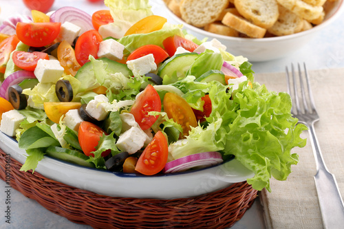 Greek salad with feta cheese black olives and bruscheta
