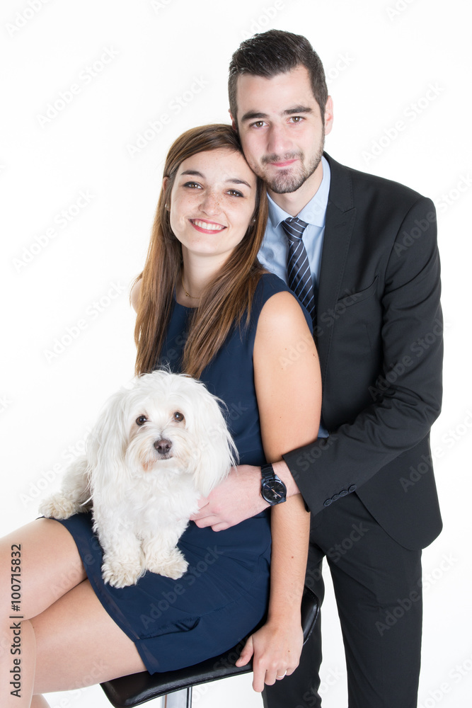 Couple cuddling dog loving family isolated Couple cuddling dog loving family isolated