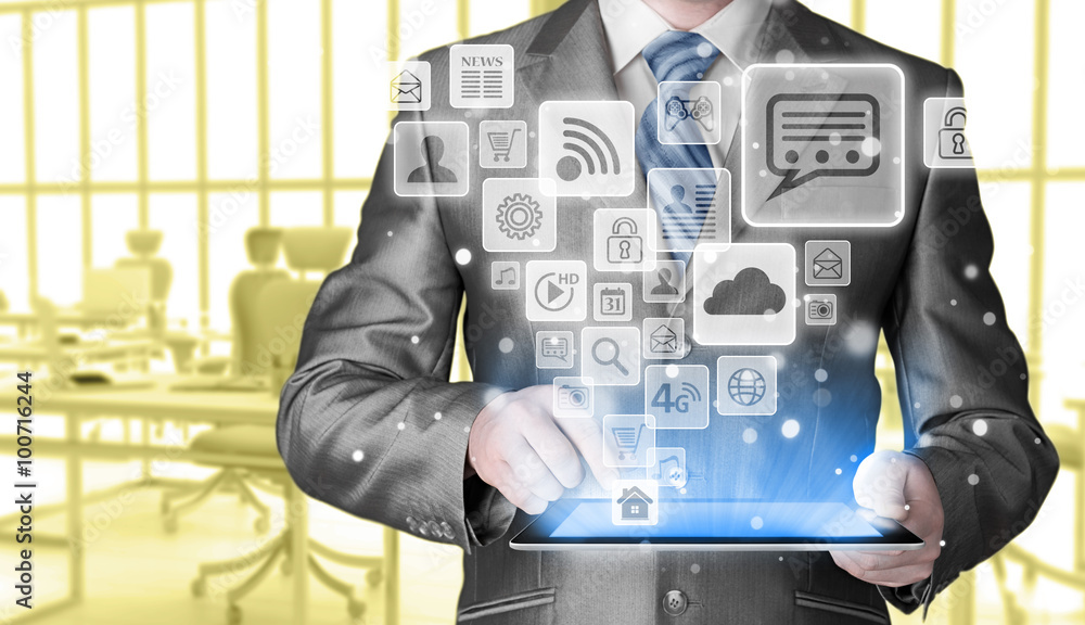 Business man using tablet PC with social media icon set Business man using tablet PC with social media icon set