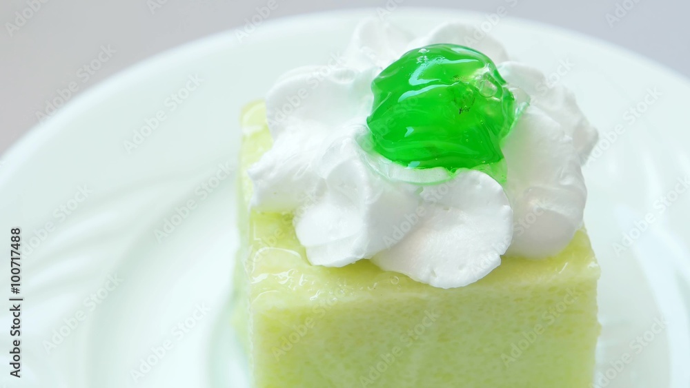 Catering. Small dessert kiwi pudding with green cherry on top.
Catering. Small dessert kiwi pudding with green cherry on top.