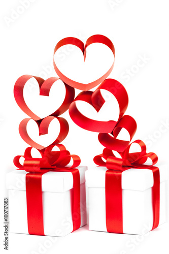 Gift box, bow and heart on a white background