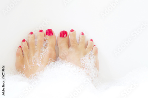 Feet soaking in spa bath
