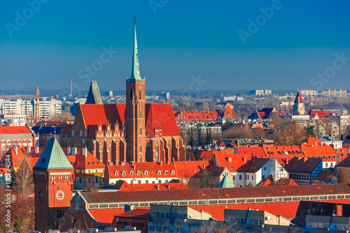 Aerial view of Ostrow Tumski with church of the Holy Cross and St. Bartholomew from St. Mary Magdalene Church in the morning in Wroclaw, Poland
