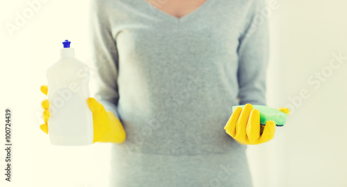 close up of woman with sponge and cleanser