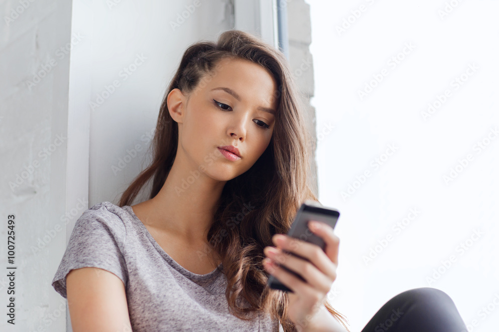 sad pretty teenage girl with smartphone texting sad pretty teenage girl with smartphone texting
