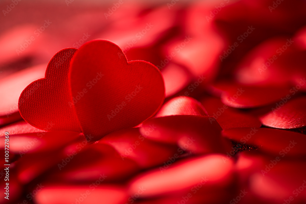 Two little red satin hearts on red background, valentines day or celebrating love Two little red satin hearts on red background, valentines day or celebrating love