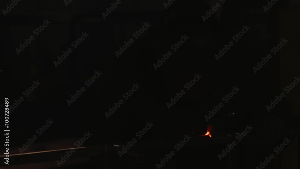 a man working at the plant from the welding machine a man working at the plant from the welding machine