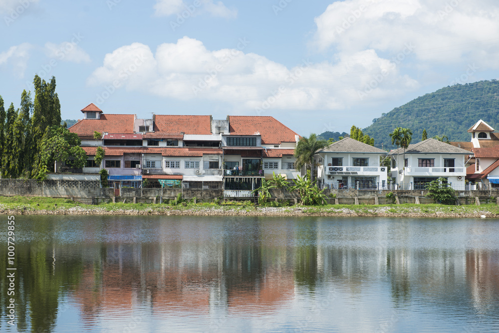 houses along the waterfront with a reflection houses along the waterfront with a reflection