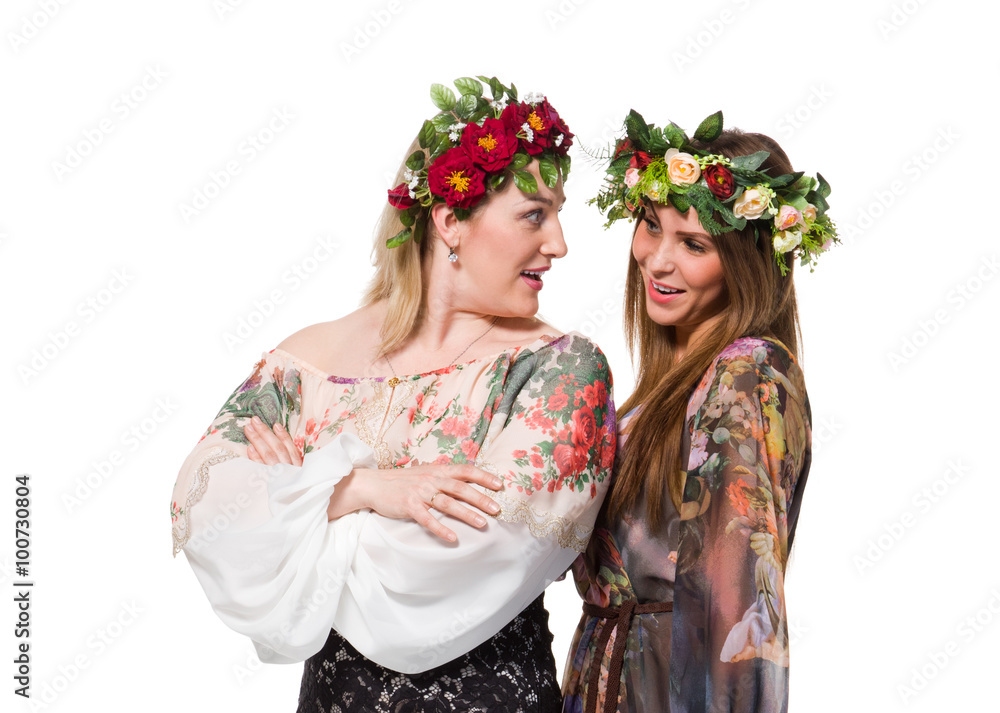 Beautiful girl and woman in wreath of flowers Beautiful girl and woman in wreath of flowers