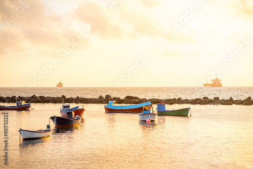 Fishing boats on the sunrise