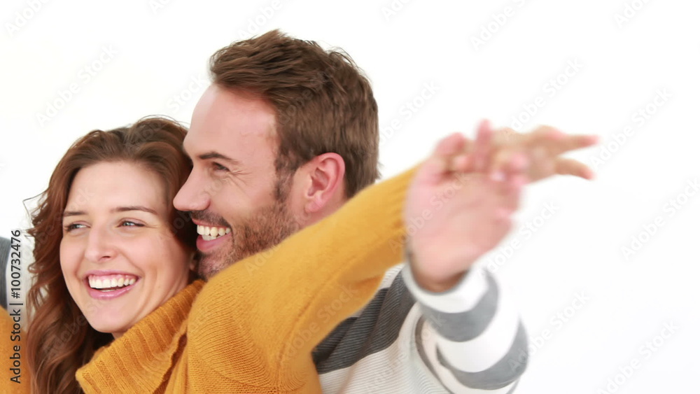 Smiling couple embracing on white background Smiling couple embracing on white background