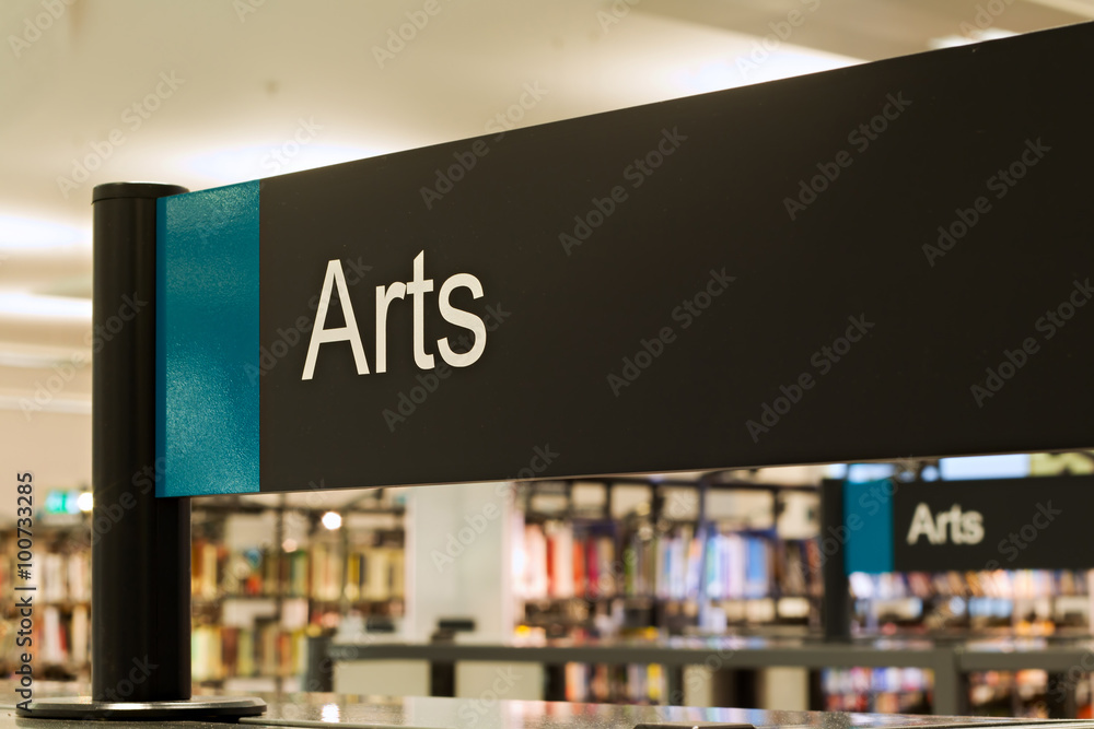 Arts section sign inside a modern public library