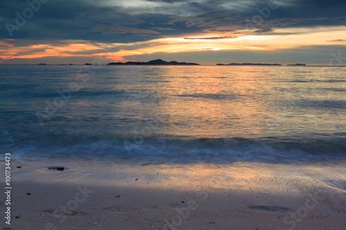 Footprint on beach at sunset time