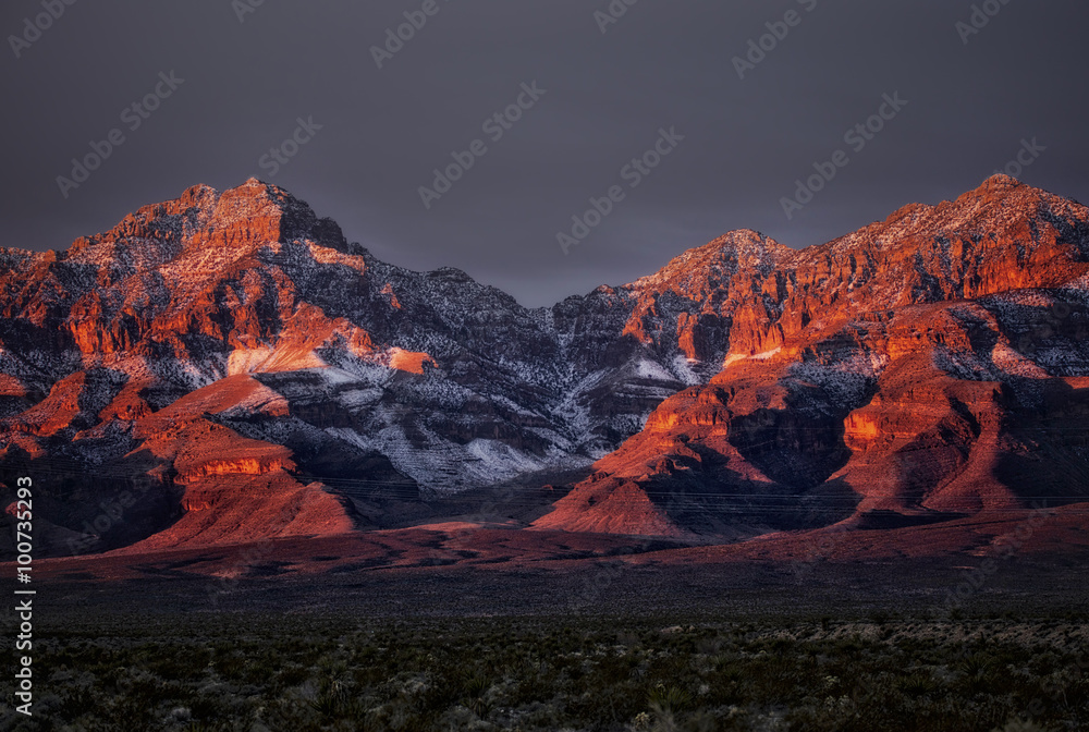 Sunrise over snow dusted peaks