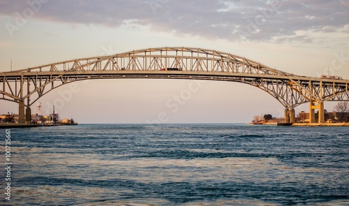 The twin spans of the Blue Water Bridges crossing between Sarnia, Ontario and Port Huron, Michigan. This is the second busiest crossing US and Canada with the first being the Windsor Tunnel. © ehrlif