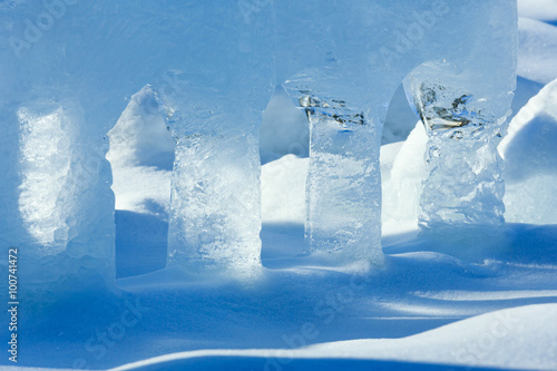 Transparent columns of ice on the snow