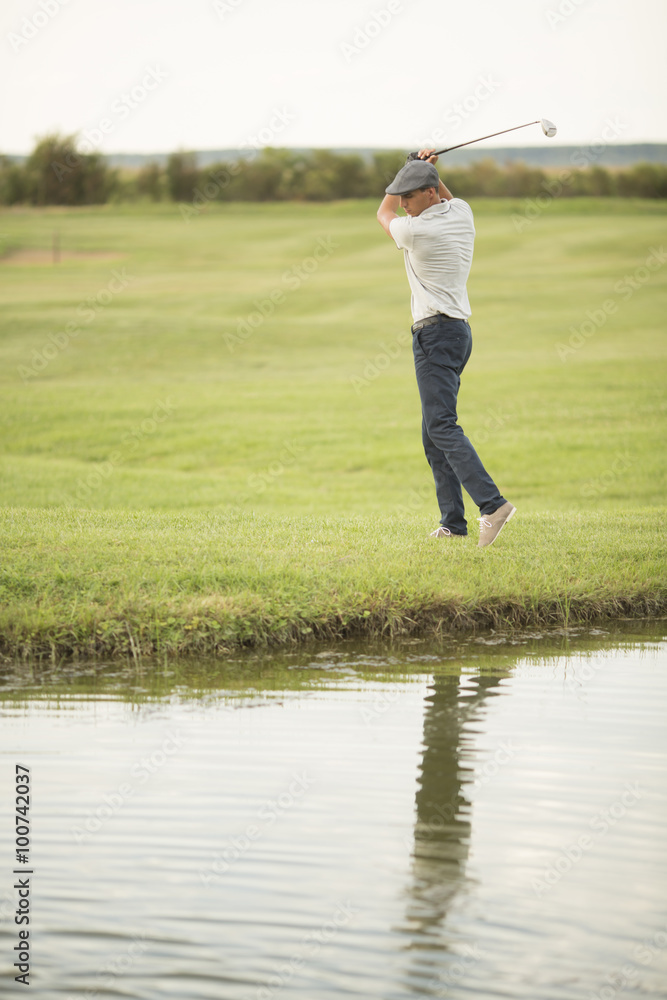 Young man playing golf Young man playing golf
