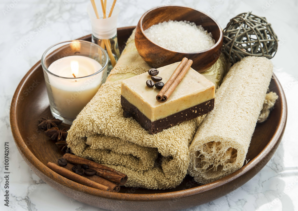 Spa-care products with coffee and cinnamon soap, towel and candl Spa-care products with coffee and cinnamon soap, towel and candl