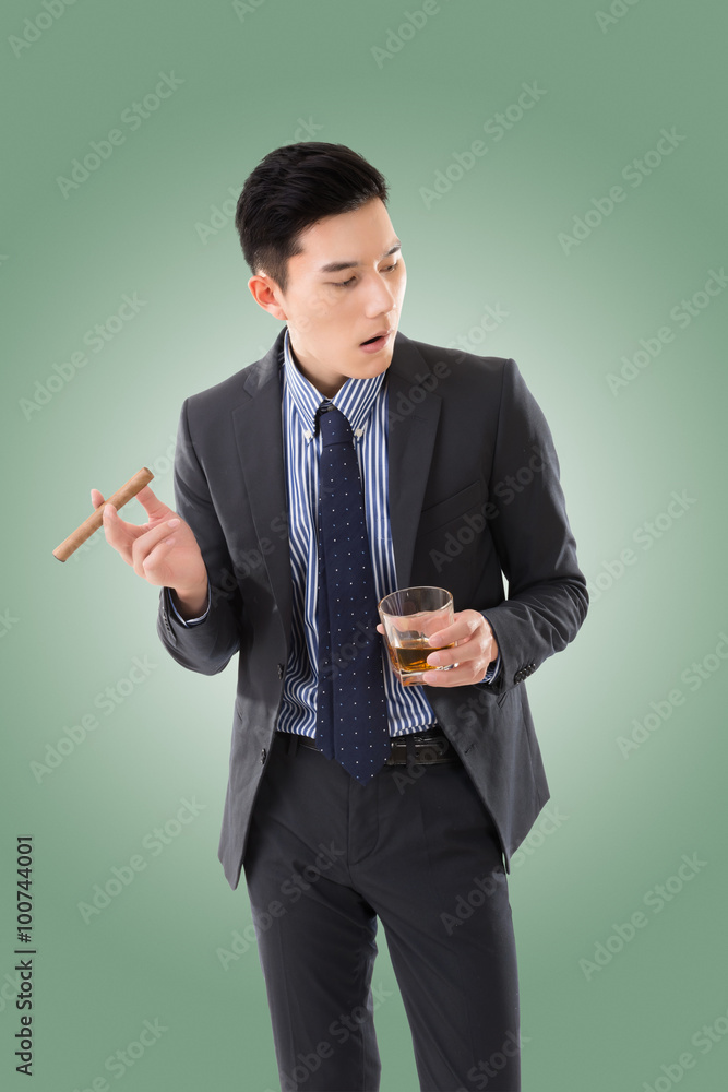 businessman holding a cigar