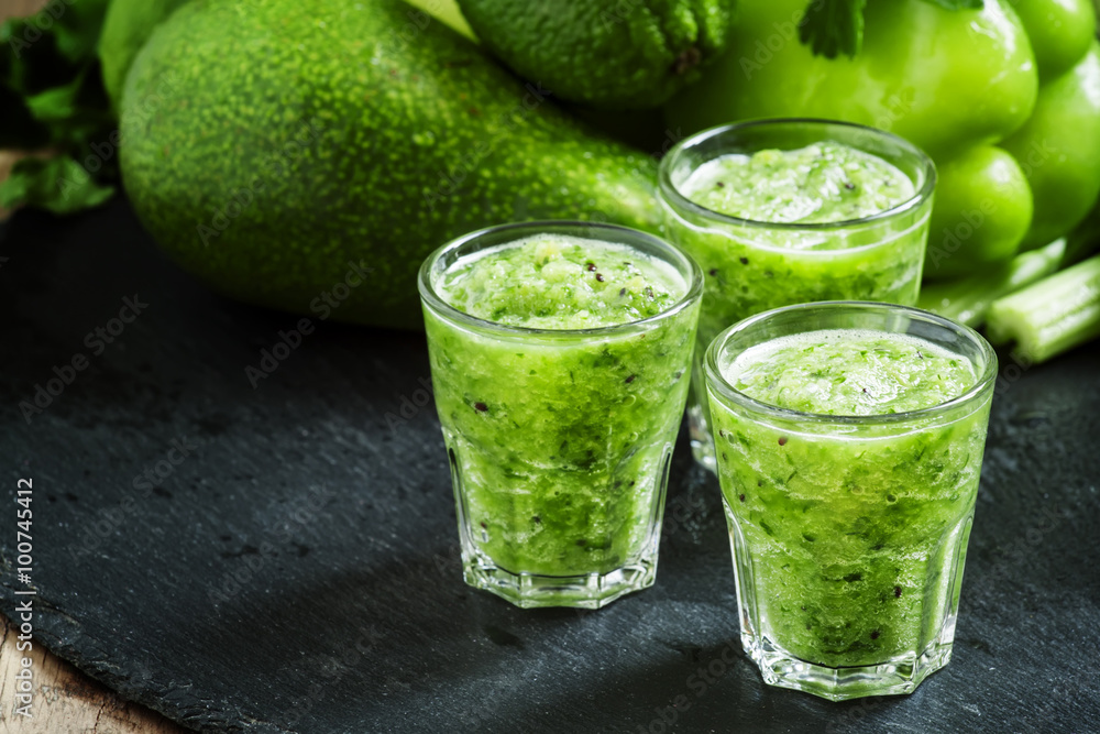Fototapeta premium Fresh green detox smoothie made from apples, avocados, greens, l