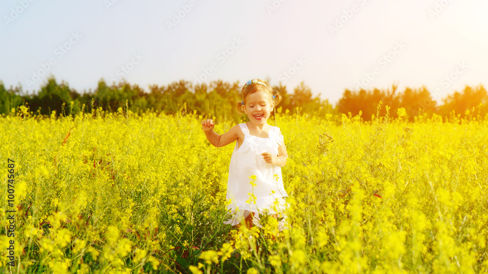 happy little child girl running on field with yellow flowers happy little child girl running on field with yellow flowers