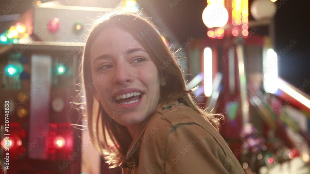 Beautiful woman having fun in amusement park, waving to the camera Beautiful woman having fun in amusement park, waving to the camera