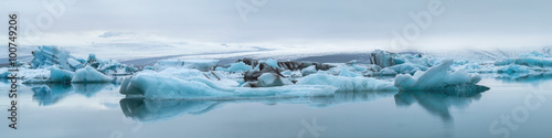 blue icebergs with fog in ice lagoon in Iceland