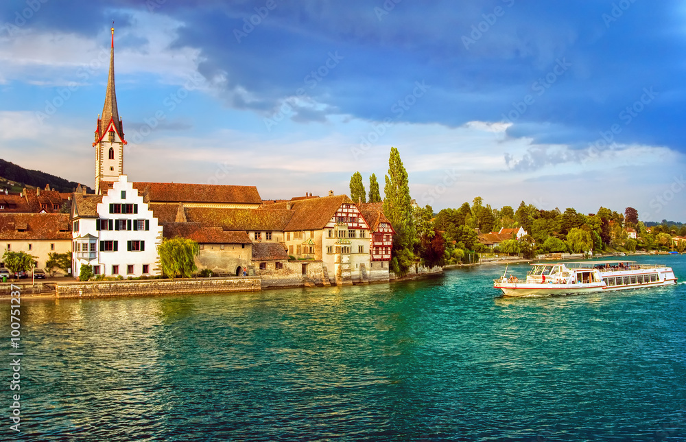 Fototapeta premium Cruise ship going down the Rhine river in Stein am Rhein, Switzerland