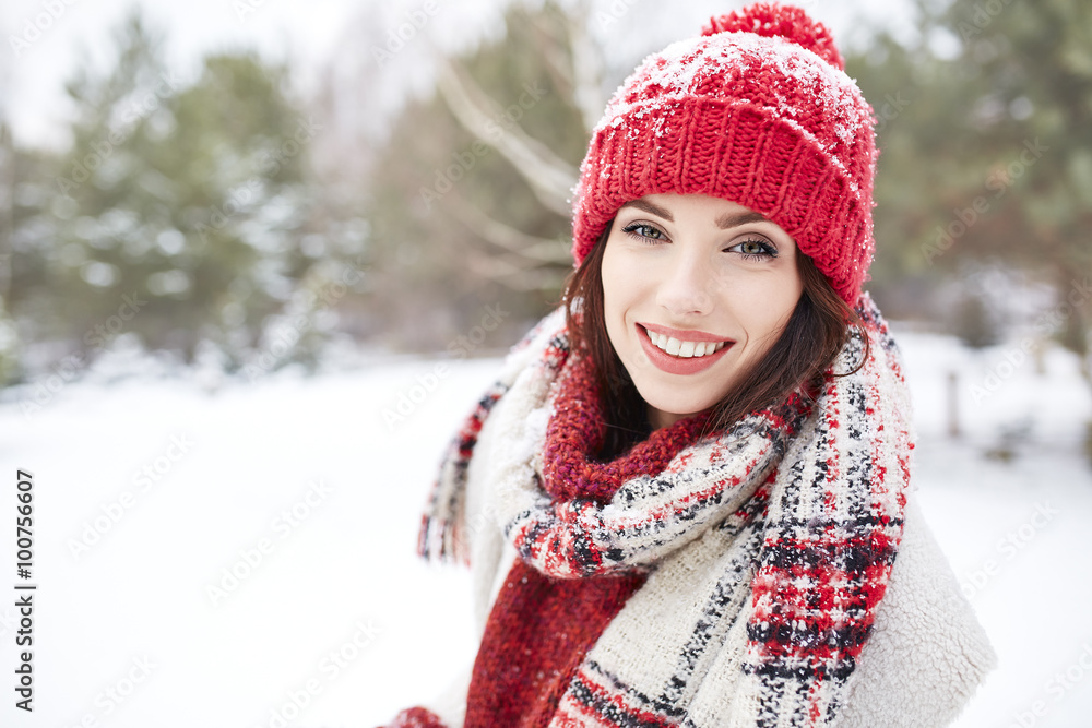 Pretty woman with red hat smiling in winter day Pretty woman with red hat smiling in winter day